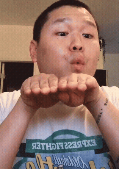 Man Blowing Kiss In Express Lighter T-Shirt GIF