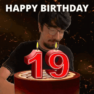 Man Blowing Out 19 Candles GIF