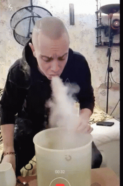 Man Blowing Smoke Out Of Bucket 00:32 GIF