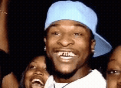 Man Blue Hat White Shirt Laughing With Two Women GIF