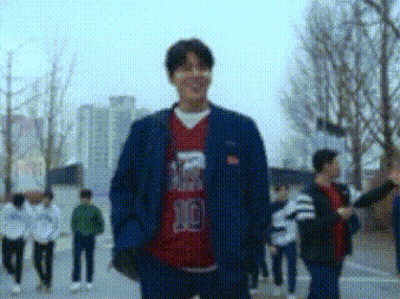 Man Blue Jacket Red Shirt Number 10 Walking GIF