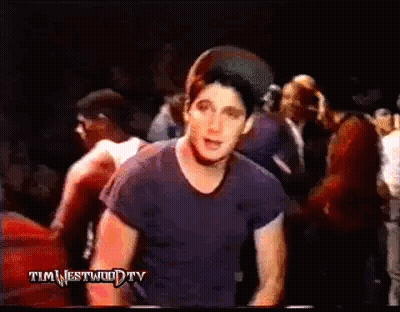 Man Blue Shirt Before Crowd In Dark Room GIF