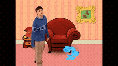 Man Blue Sweater Beside Red Chair Blue Dog GIF