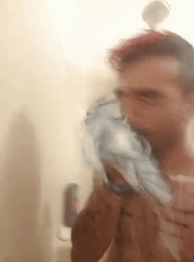 Man Brushing Teeth In Shower GIF