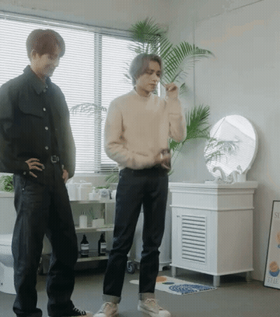 Man Brushing Teeth Next To Another Man GIF