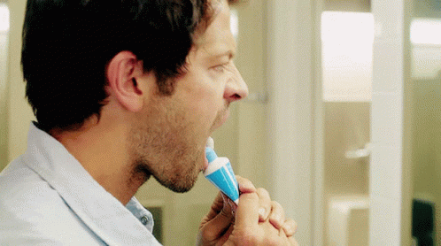 Man Brushing Teeth With Blue Toothpaste GIF