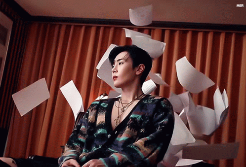 Man By Curtain Papers Falling Mer GIF