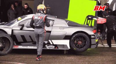 Man By Race Car Saying Total GIF