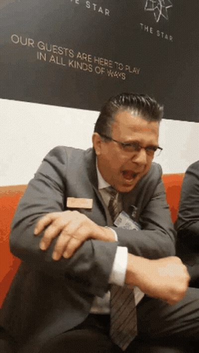 Man By Sign Our Guests Here To Play GIF