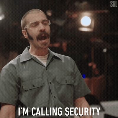 Man Calling Security With Safety Goggles GIF