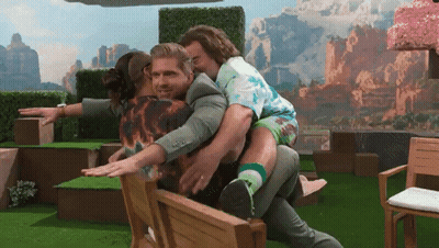 Man Carrying Another Man On His Back While Sitting In Chair GIF