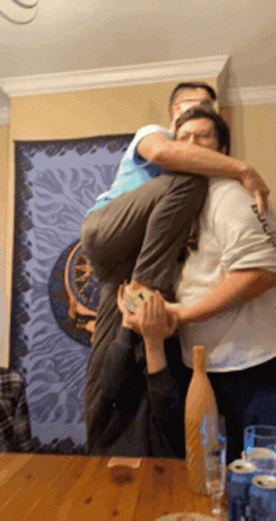 Man Carrying Another Man On Shoulders GIF