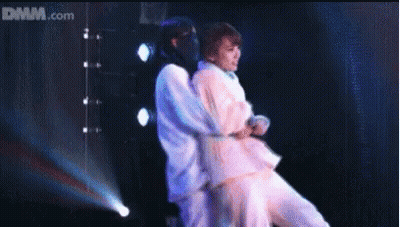 Man Carrying Another Man On Stage Dmm.com GIF