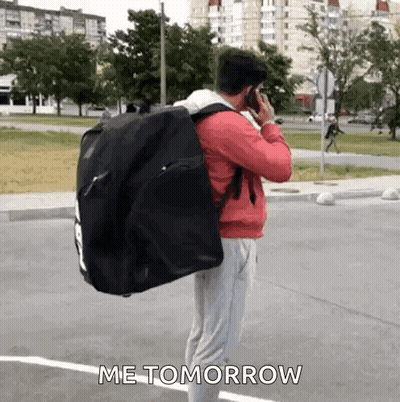 Man Carrying Black Bag Talking On Cell Phone GIF