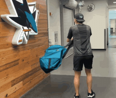 Man Carrying Blue Bag At San Jose Sharks GIF