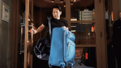 Man Carrying Blue Suitcase And Black Bag GIF