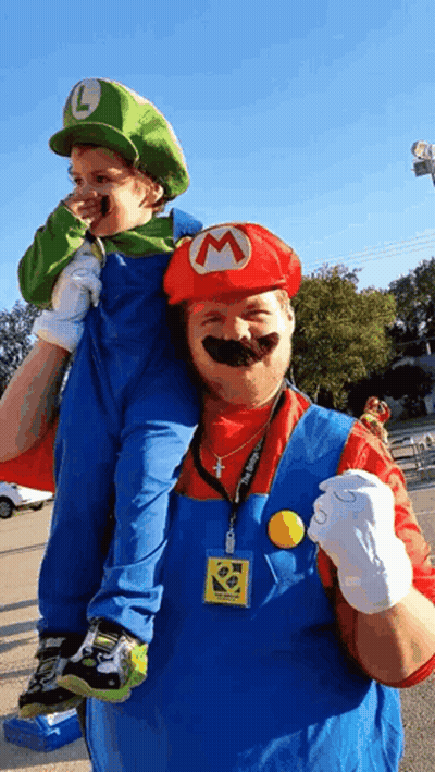Man Carrying Boy On Shoulders As Mario And Luigi GIF