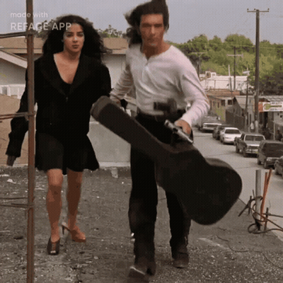 Man Carrying Guitar Case Woman Walking Reface App GIF