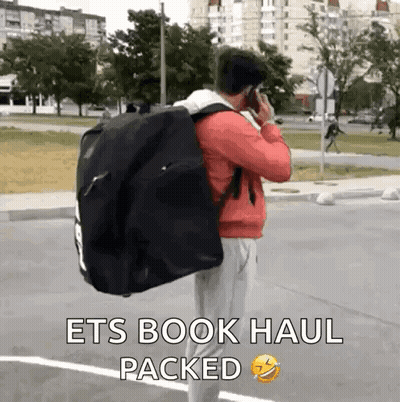 Man Carrying Large Black Bag GIF