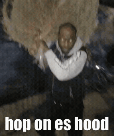 Man Carrying Large Object Hop On Es Hood GIF