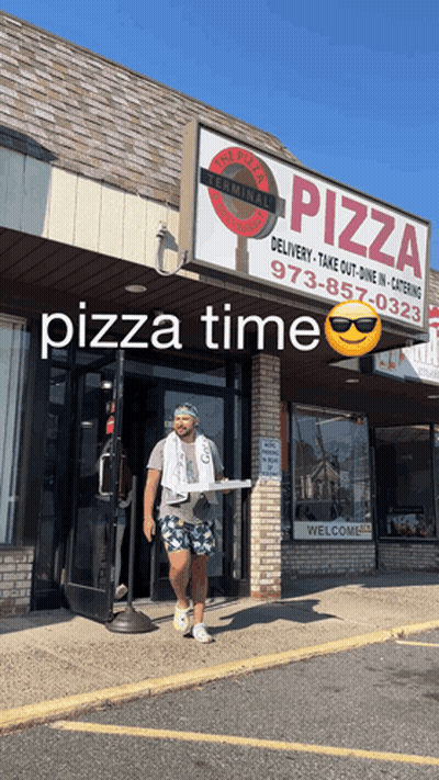 Man Carrying Pizza Box Walks Into Pizza Terminal GIF