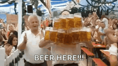 Man Carrying Stack Of Beer Mugs At Beer Festival GIF
