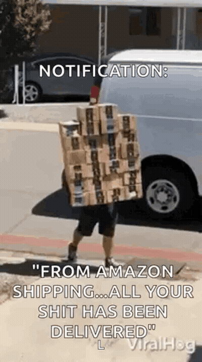 Man Carrying Stack Of Boxes In Front Of Van GIF