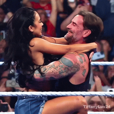 Man Carrying Woman In Wrestling Ring With Hashtag Tiffanyluv24 GIF