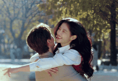 Man Carrying Woman On Back Hugging GIF