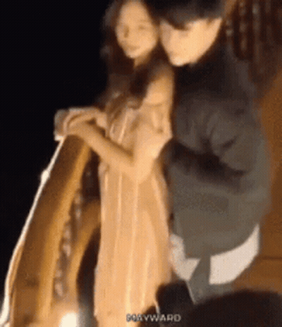 Man Carrying Woman On Back In Dark Room GIF