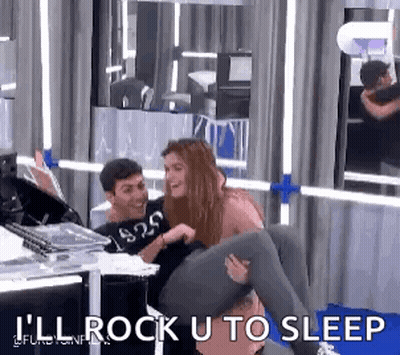 Man Carrying Woman On Shoulders While Woman Laughs GIF