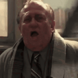Man Catching Sneeze Spray GIF