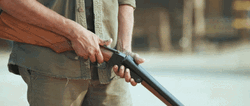 Man Checking His Shotgun GIF