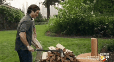 Man Chopping Wood In Yard Saying Destination Romance GIF