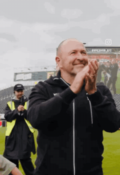 Man Clapping Hands In Field GIF