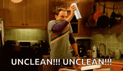 Man Cleaning Kitchen Counter Says Unclean Unclean GIF