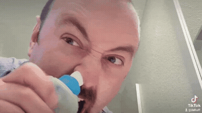 Man Cleaning Nose With Toothbrush GIF