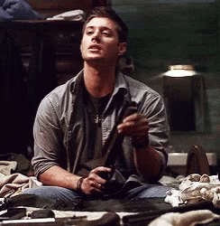 Man Cleaning Shotgun GIF