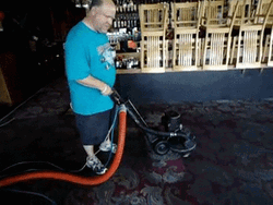 Man Cleaning The Cement Floor GIF