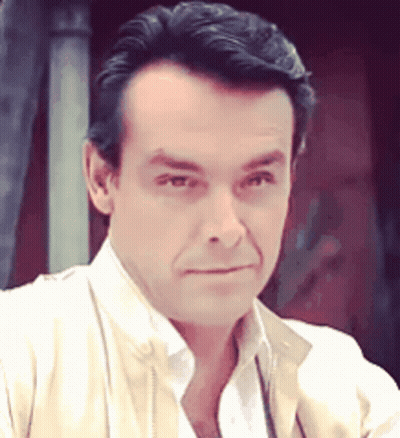 Man Close Up Wearing White Shirt And Tan Jacket GIF