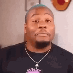 Man Closes Mouth Holding In Laugh GIF
