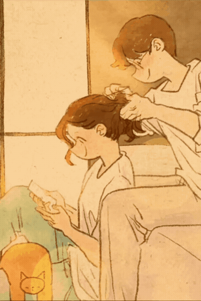 Man Combing Woman's Hair With Cat GIF