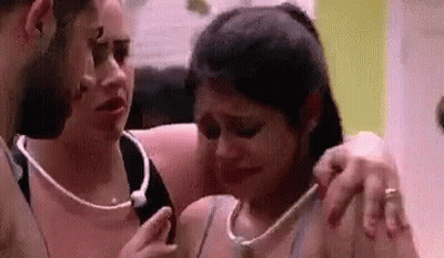 Man Comforting Crying Woman While Another Looks On GIF