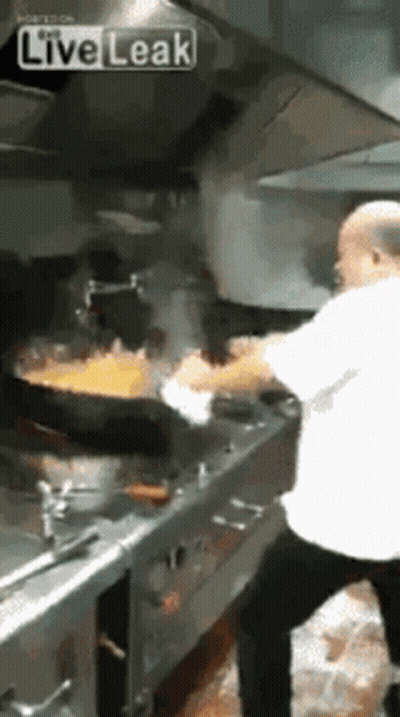 Man Cooking Food In Kitchen GIF