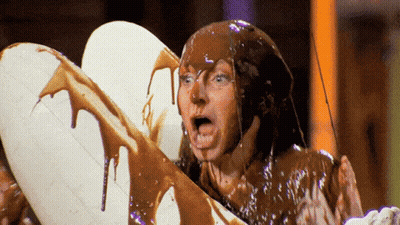 Man Covered In Chocolate Holding White Balloon GIF