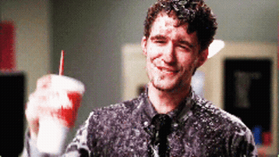 Man Covered In Foam Holding Cup With Red Straw GIF
