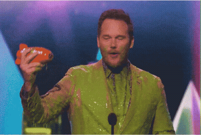 Man Covered In Green Slime Holding Nickelodeon Toy GIF