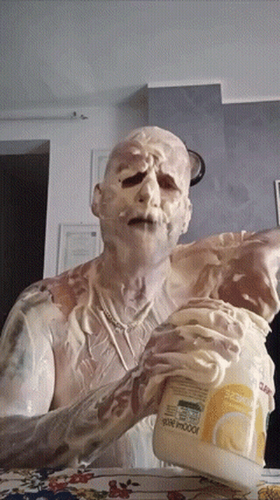 Man Covered In Mayonnaise Holding Jar GIF