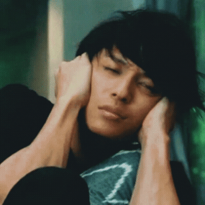 Man Covering Ears Looking Down GIF