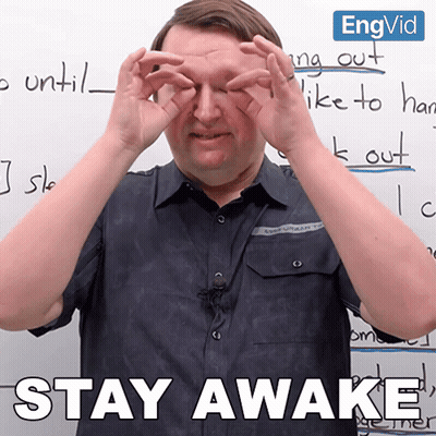 Man Covering Eyes Before Whiteboard Saying Stay Awake GIF